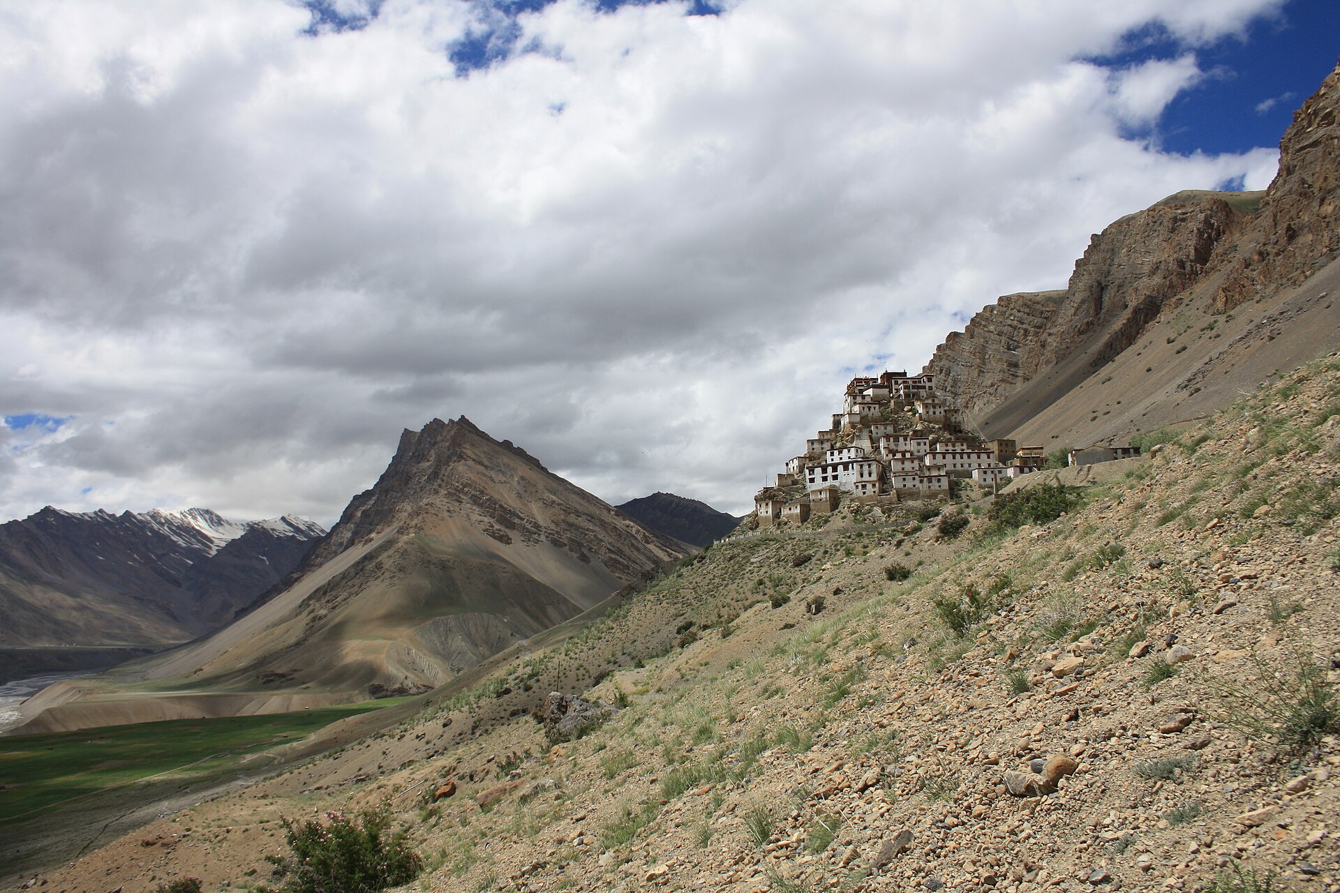 Key Monastery dramatically clings to a cliffside in Spiti Valley, showcasing a beautiful landscape and reflecting themes of.